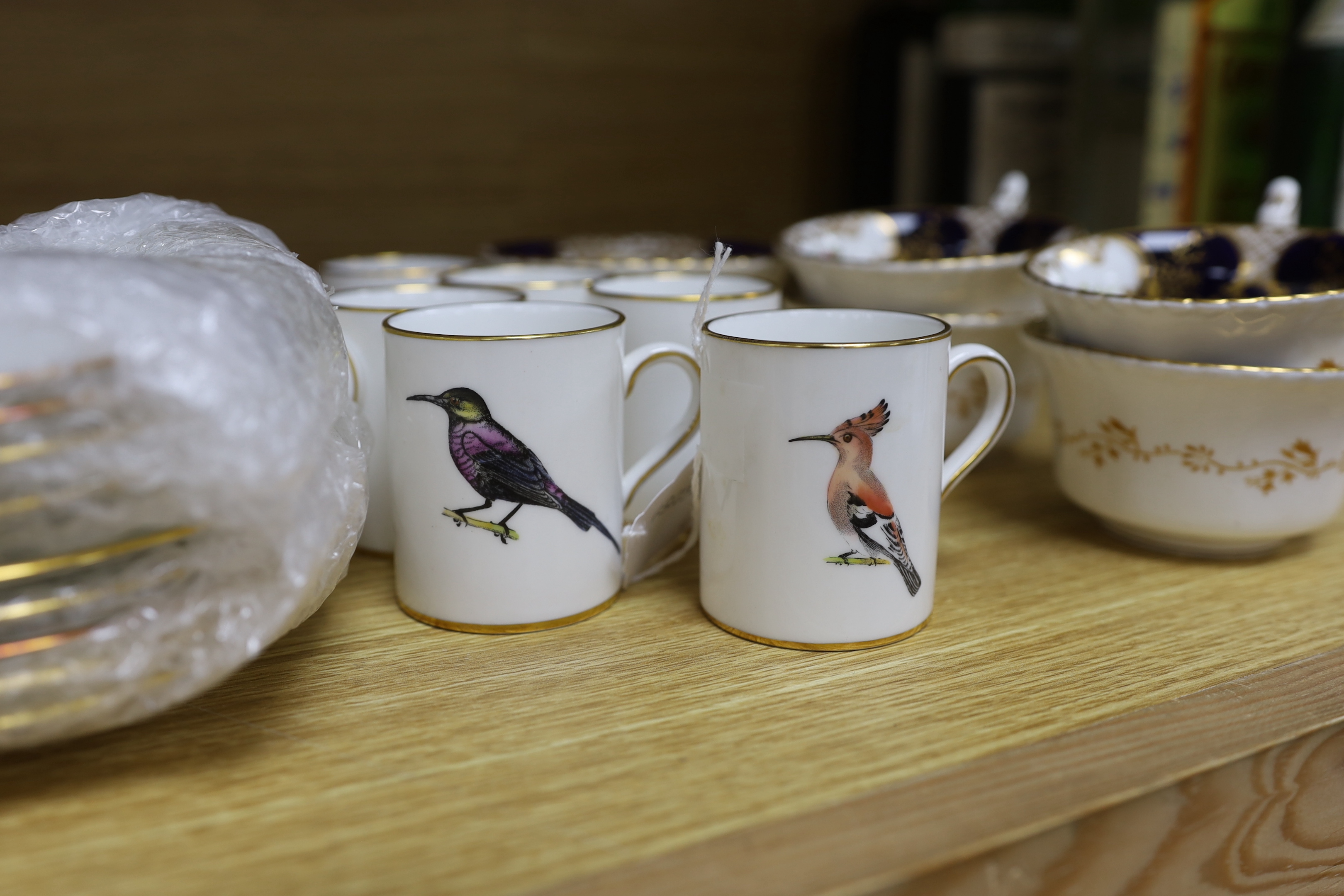 A Worcester bird decorated coffee set for ten and a Coalport tea set